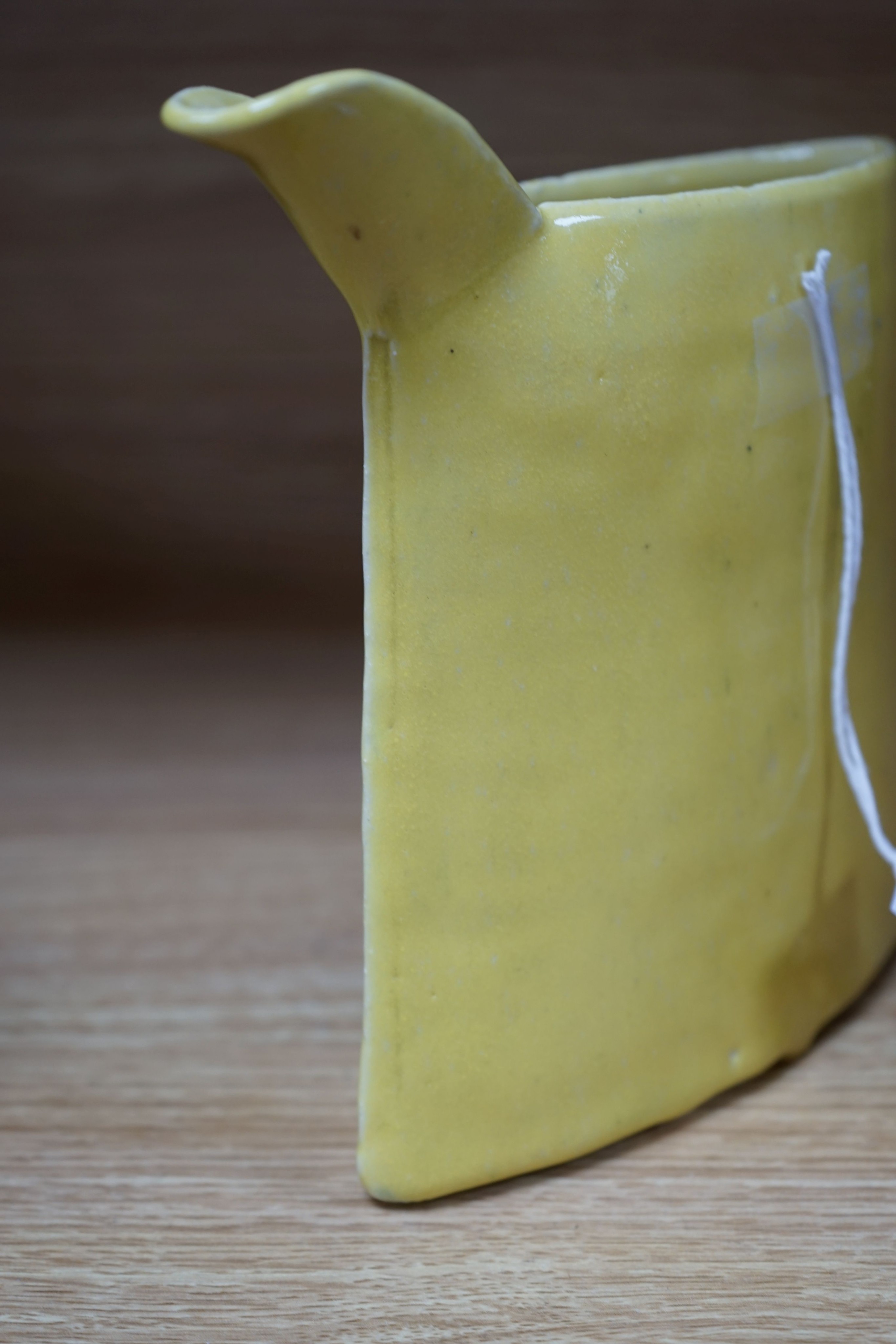 Emmanuel Cooper (1938-2012), a yellow glazed jug 20cm